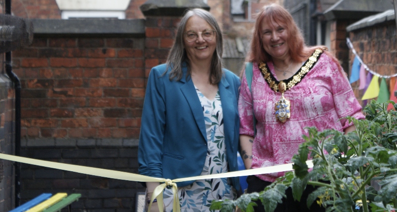 Revd Catriona Gorton (left) and Mayor Sally Graham at the ribbon-cutting for the new community garden at Union Street Baptist Church community garden opening