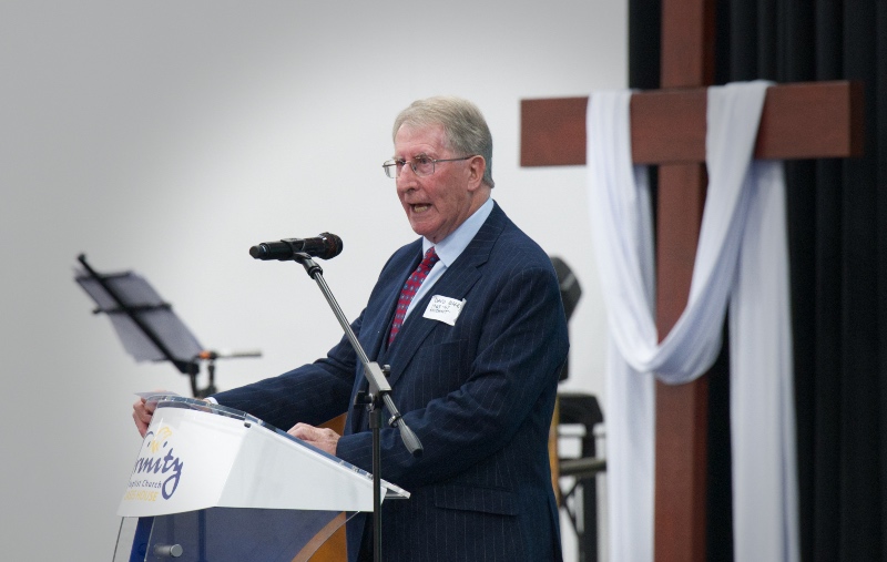 David Coffey preaching at a lecturn