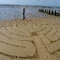 Baptist Minister's beach art creates intrigue